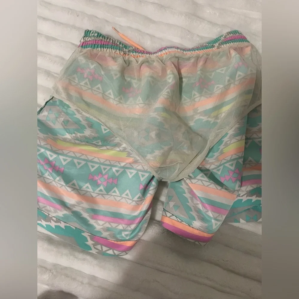chubbies Turquoise Aztec Swim Trunks with Pink and Yellow Accents